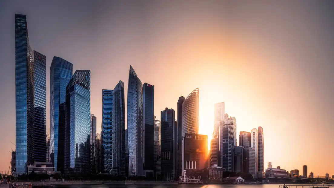 Sunset behind a modern city skyline with tall skyscrapers